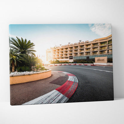 Premium architecture canvas wall art featuring a curved racetrack with red and white curbs and a modern building in the.