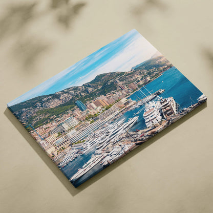 Canvas wall art print featuring a vibrant harbor scene with yachts and hillside buildings under a blue sky.