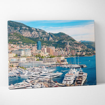 Canvas wall art featuring a vibrant coastal cityscape with yachts, buildings, and green hills under a bright blue sky.