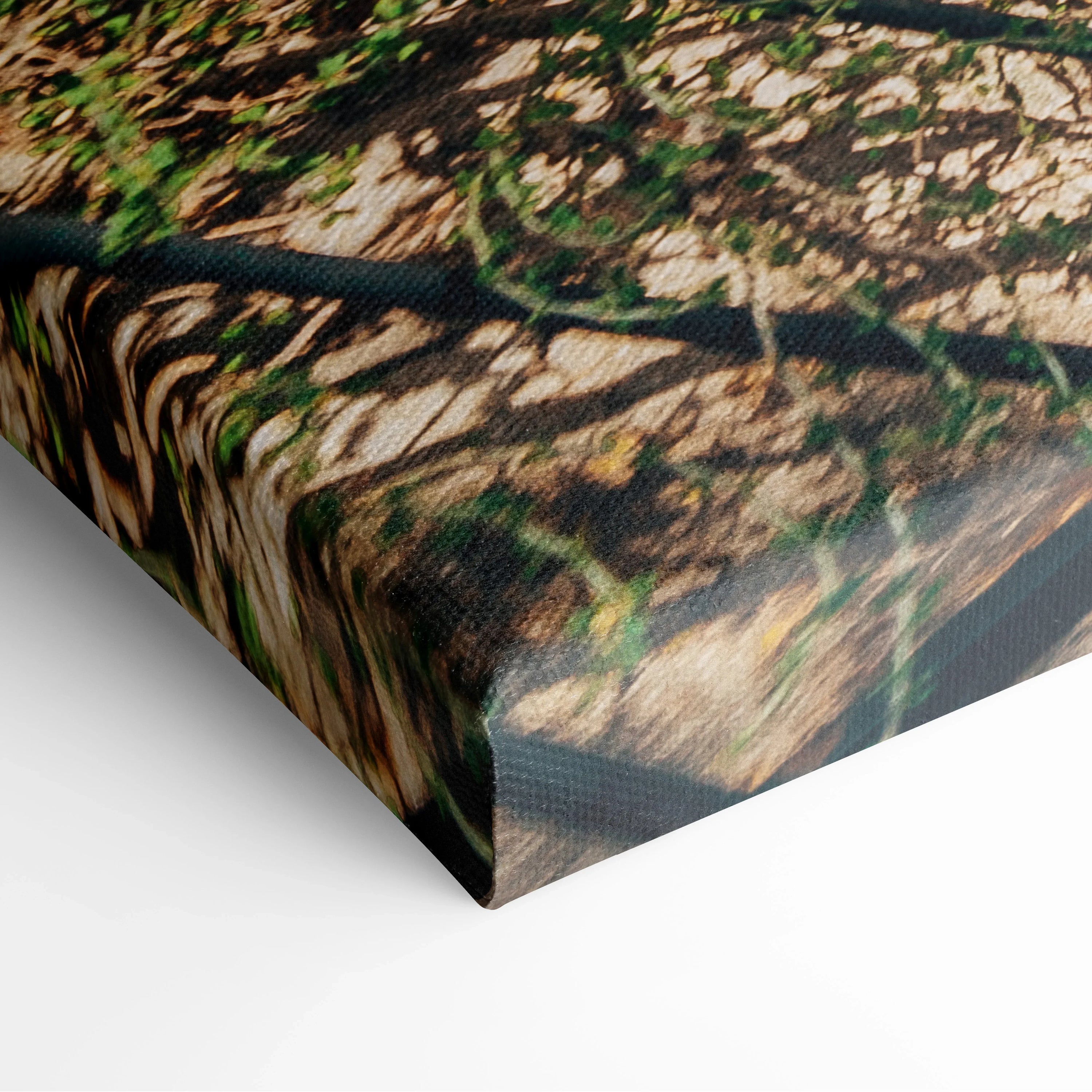 Close-up of a canvas wall art print with textured edges, featuring a beach scene with buildings and warm earthy tones.