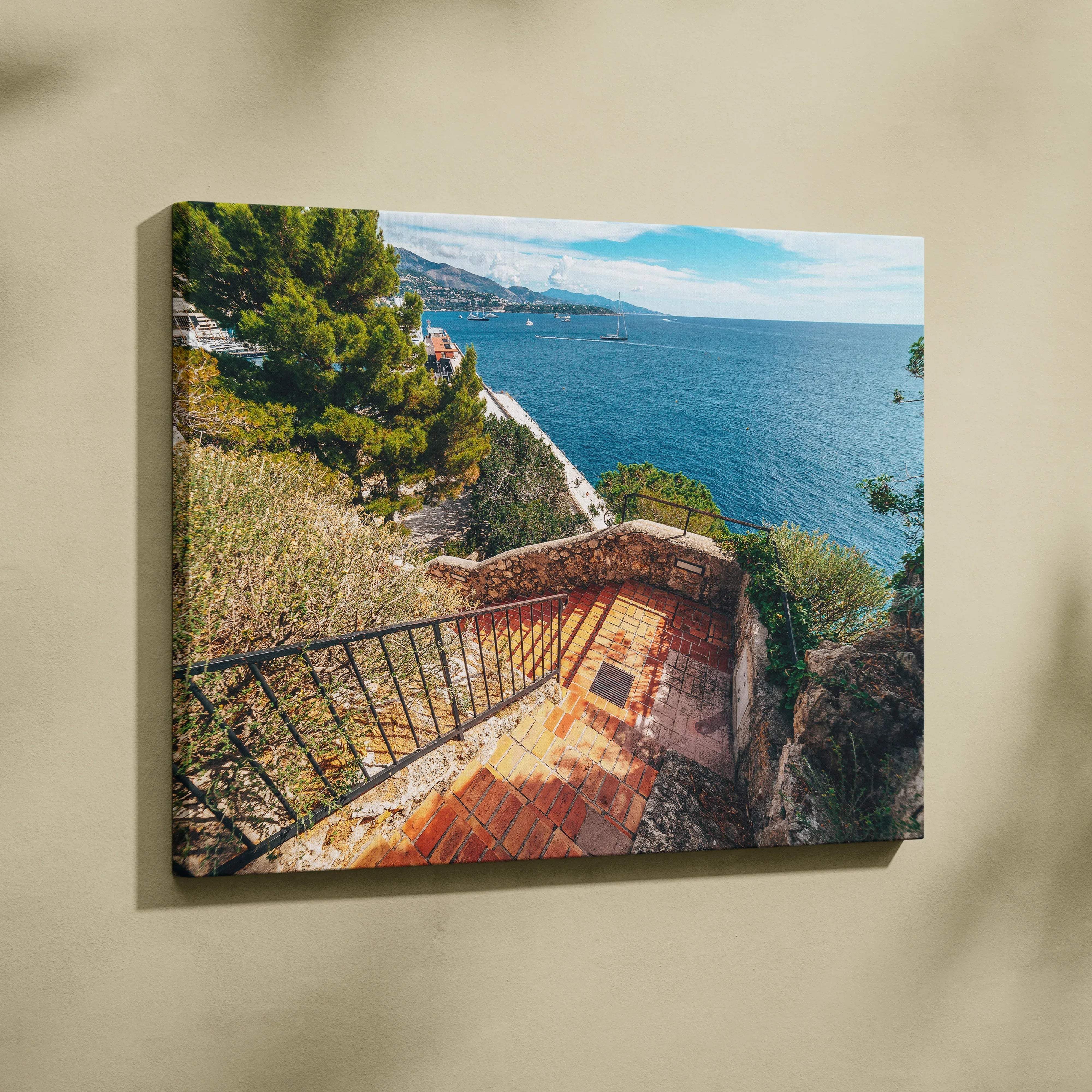 Coastal staircase overlooking crystal blue sea landscape canvas wall art featuring turquoise waters and lush greenery
