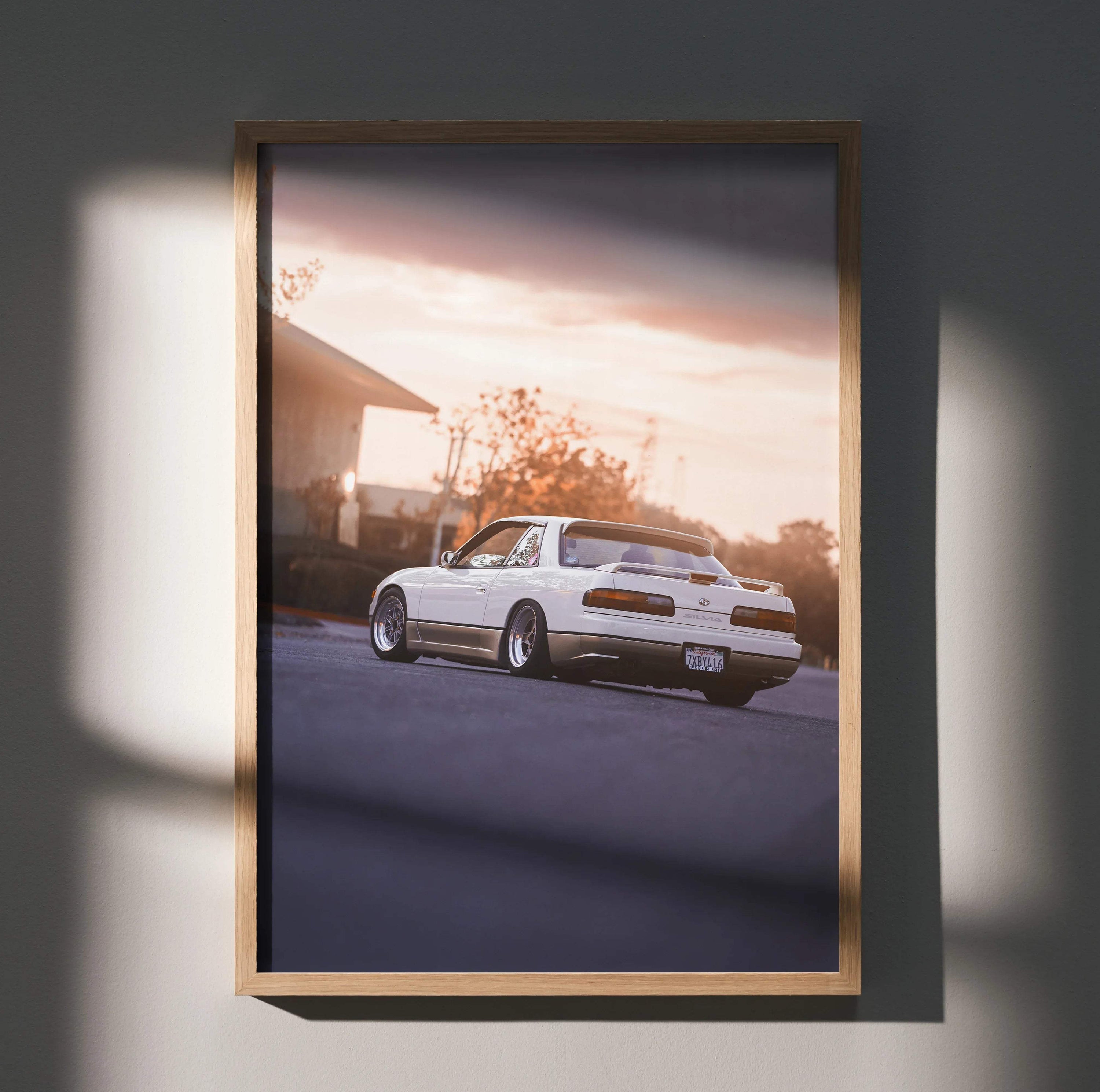 Nissan 240sx S13 Silvia poster with sunset background, automotive wall art in wooden frame.