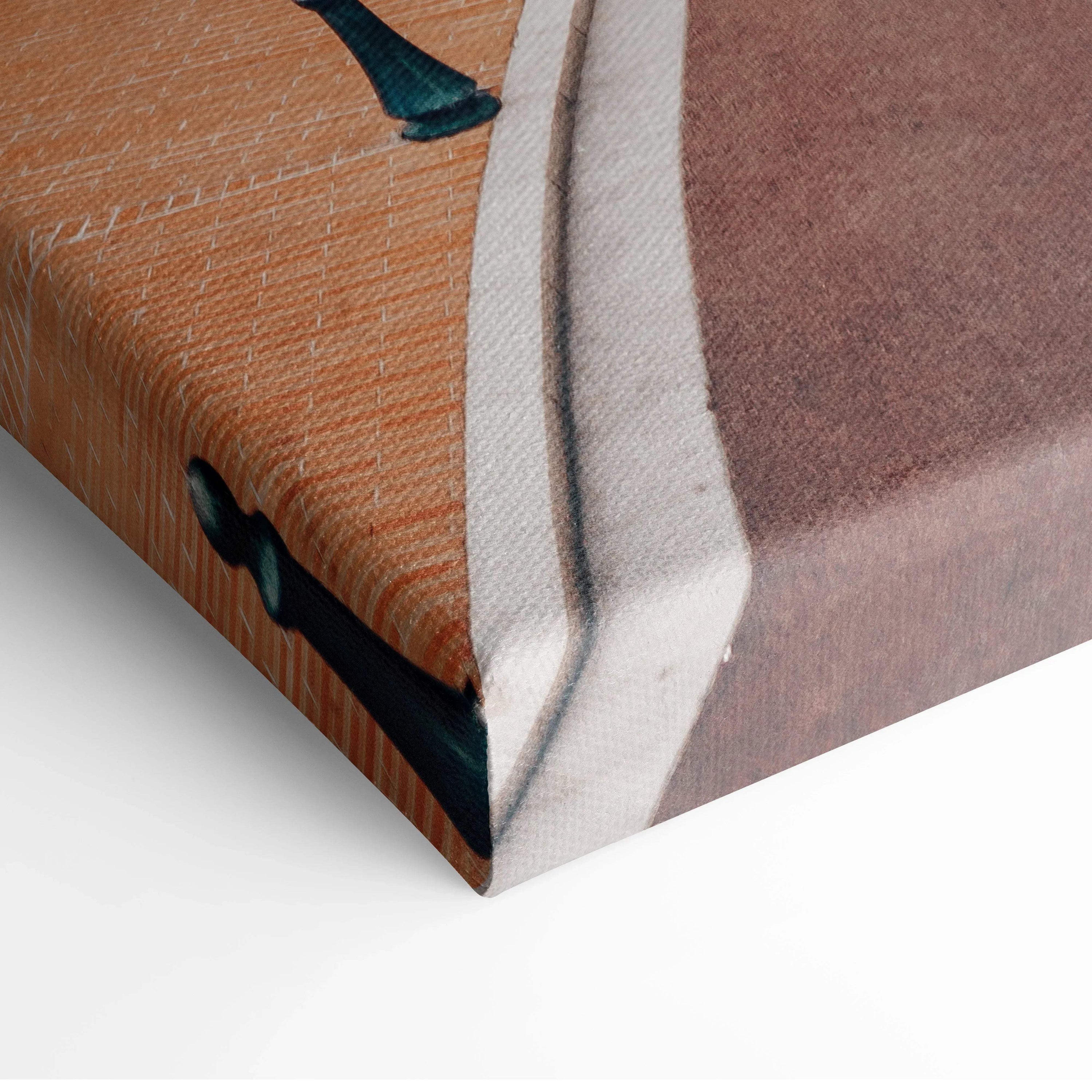 Close-up of stretched canvas wall art featuring textured digital print of architectural elements in warm brown, white, and.