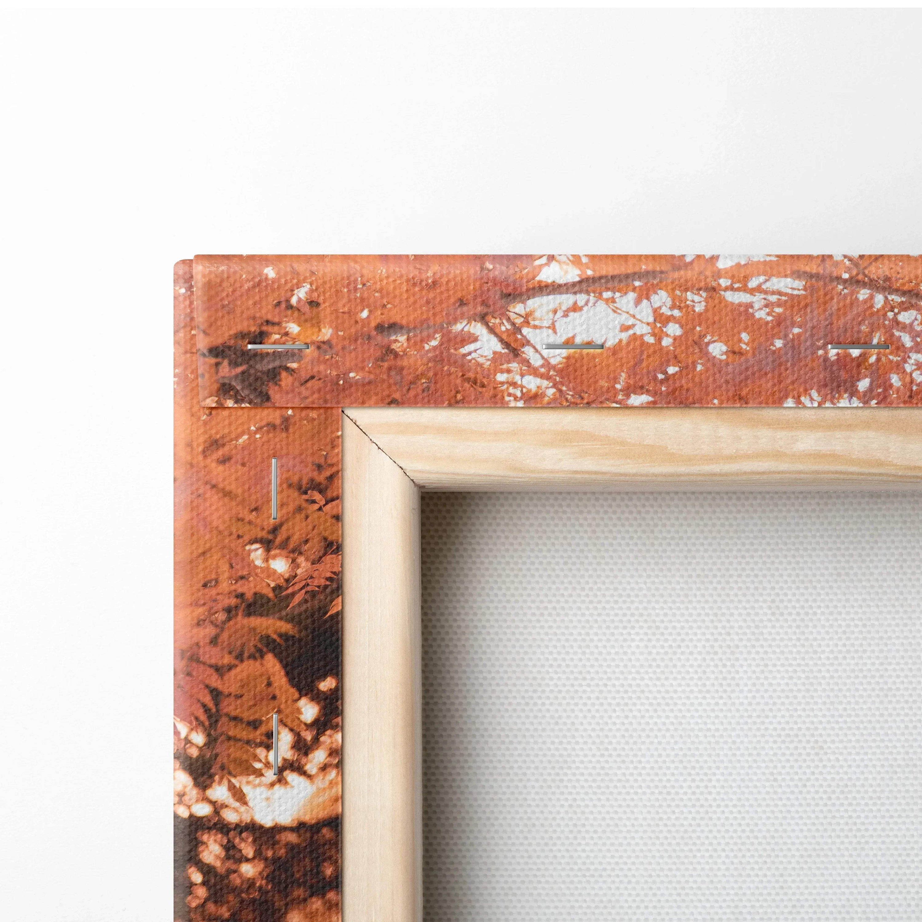 Close-up of wooden frame corner on BMW S1000RR canvas wall art with detailed orange and black design.