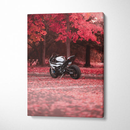 Black BMW S1000RR motorcycle against red autumn trees on vertical canvas wall art.