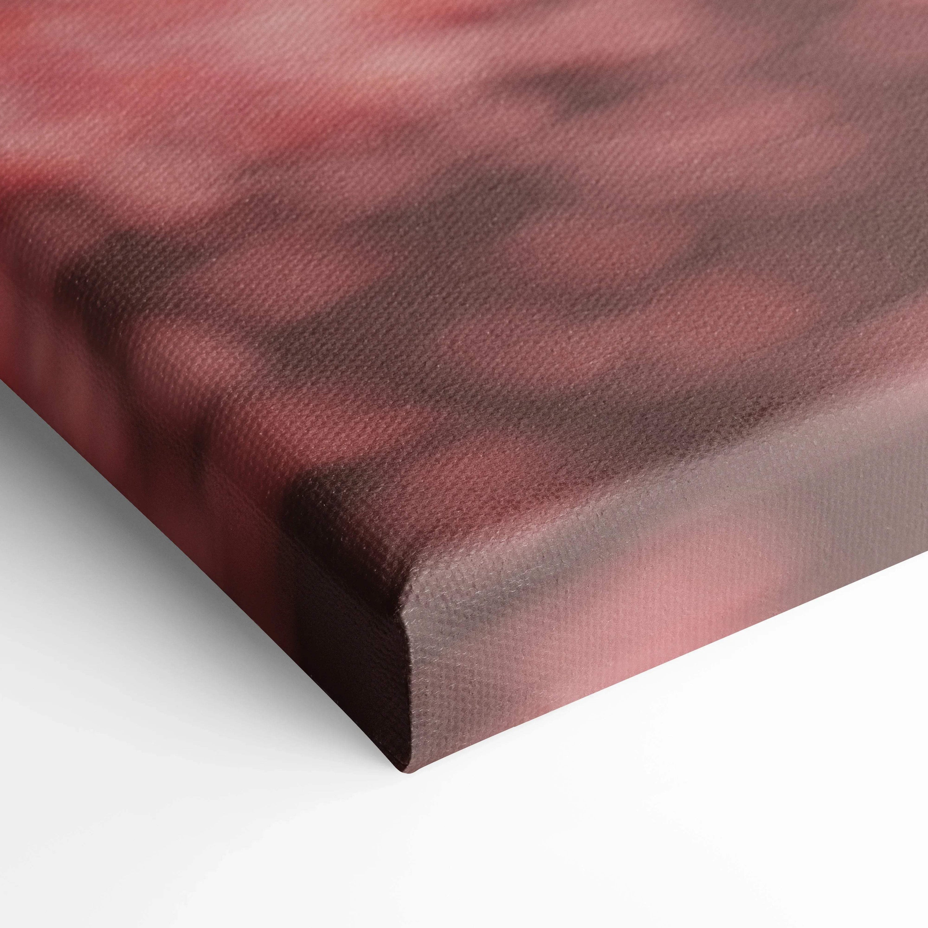 Close-up of red and black textured canvas art corner with museum-quality print wrap.