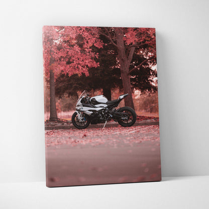 Vertical canvas art of a BMW S1000RR motorcycle parked under autumn trees with red leaves wall art.