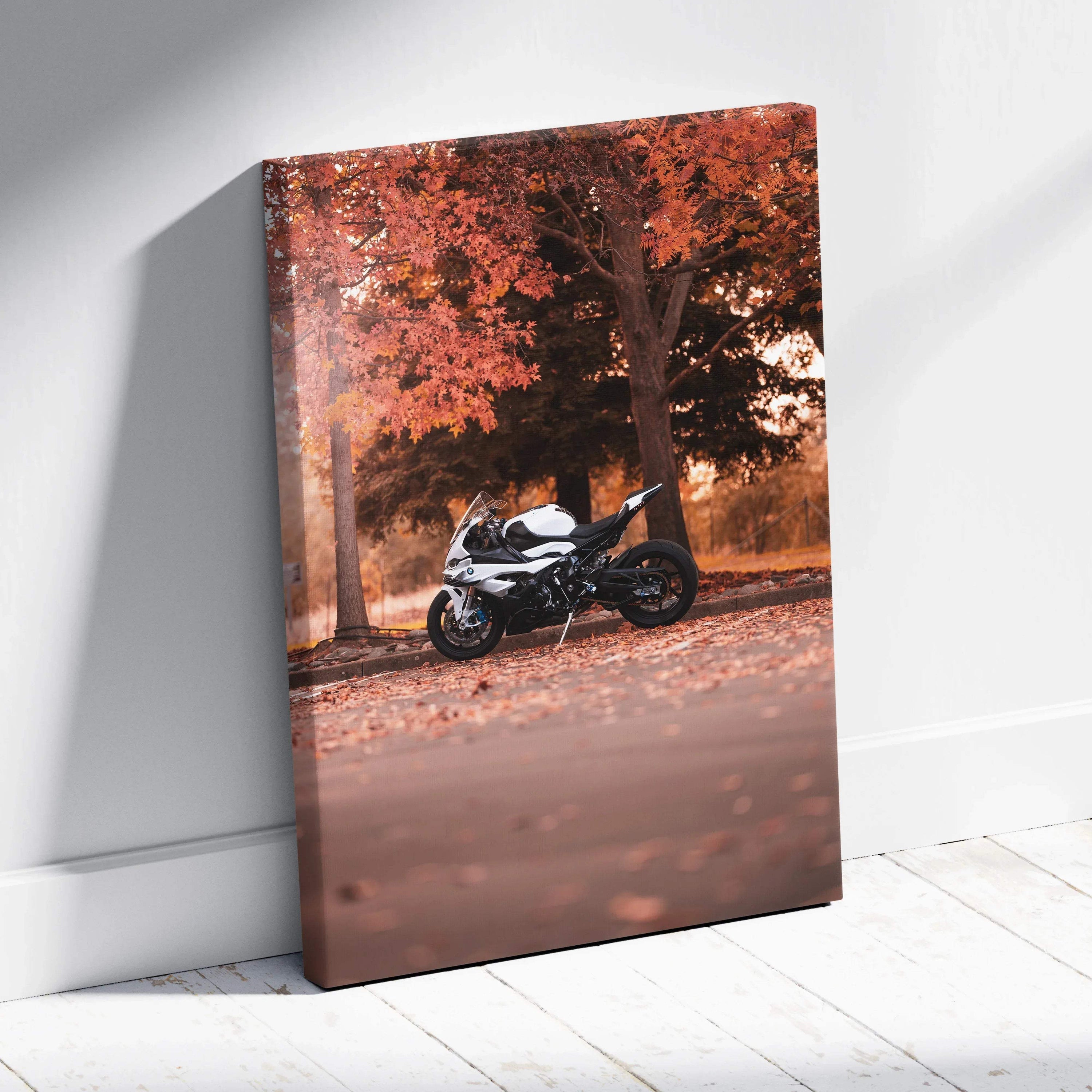 Vertical canvas art of a BMW S1000RR motorcycle against autumn trees with orange leaves wall art.