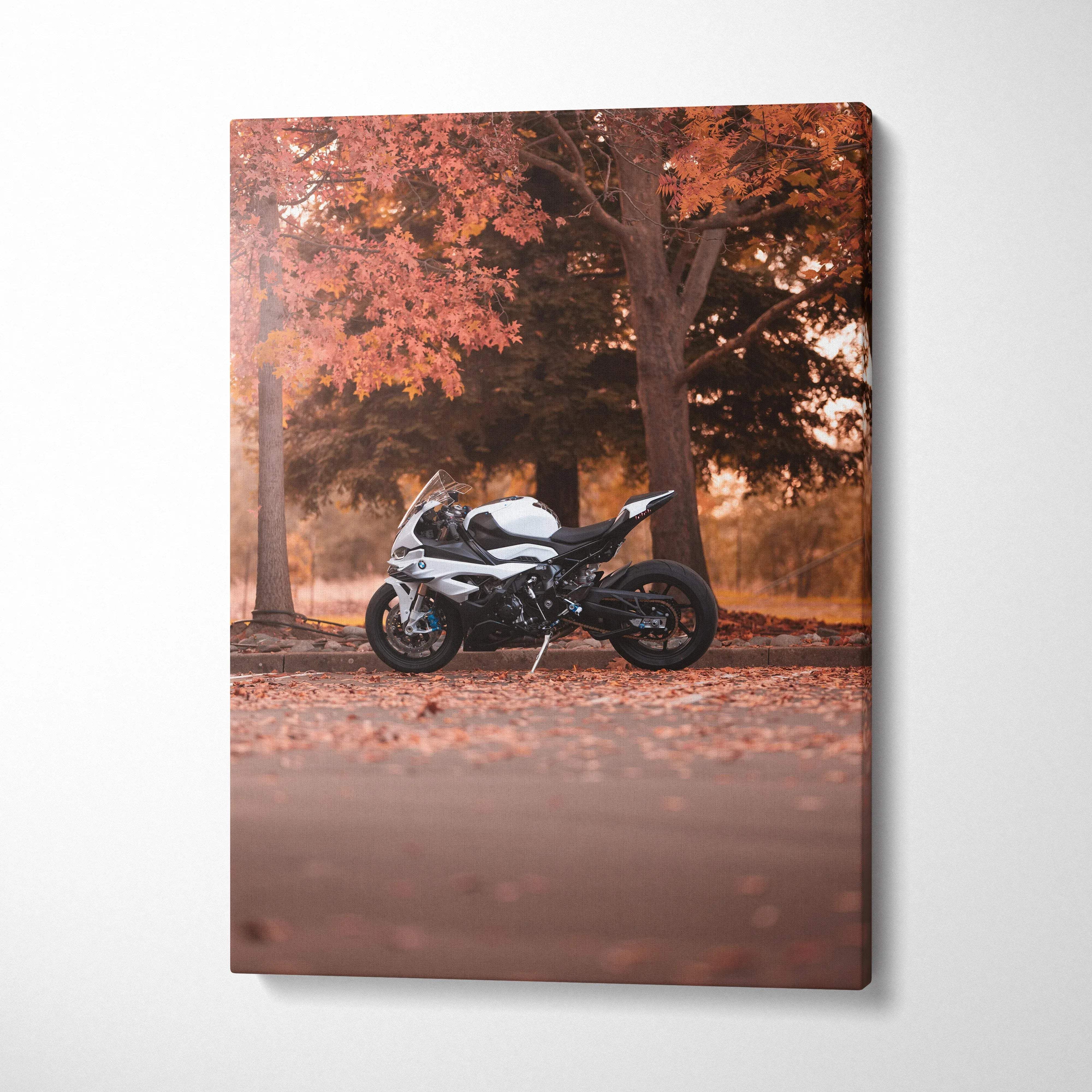 Vertical canvas art featuring a BMW S1000RR motorcycle parked under autumn trees with orange leaves.