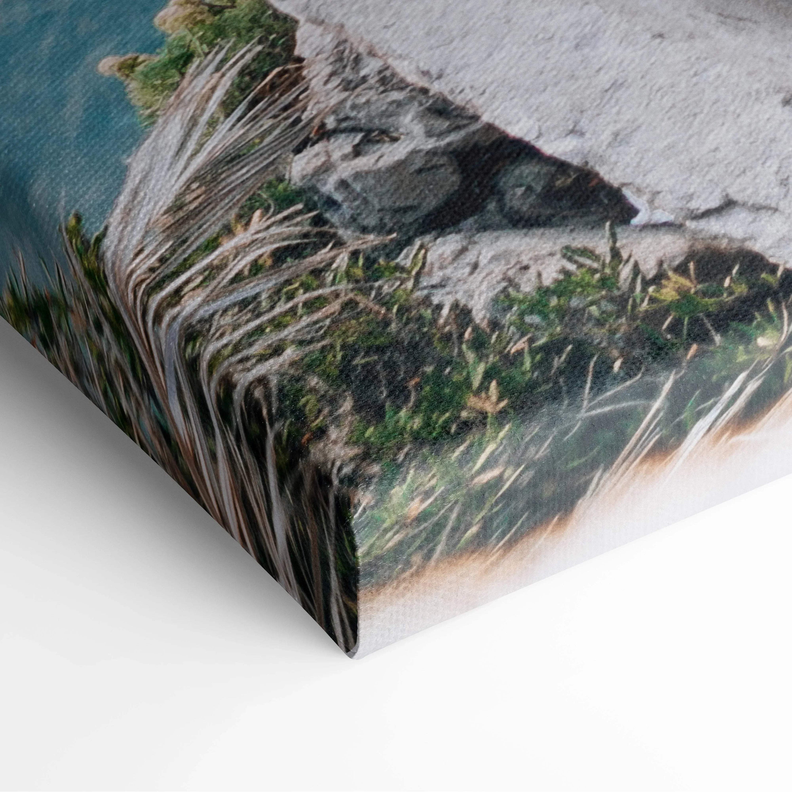 Canvas wall art print featuring a serene beach scene with modern buildings and lush greenery.