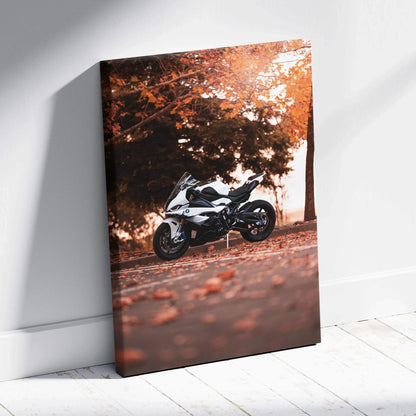 Vertical canvas art featuring a BMW S1000RR motorcycle parked on a leaf-covered path with autumn trees backdrop.