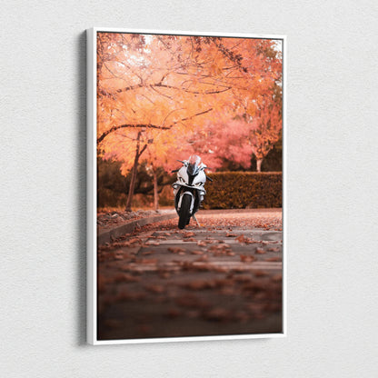 Vertical canvas art of a BMW S1000RR motorcycle on a leaf-covered path with autumn trees backdrop.