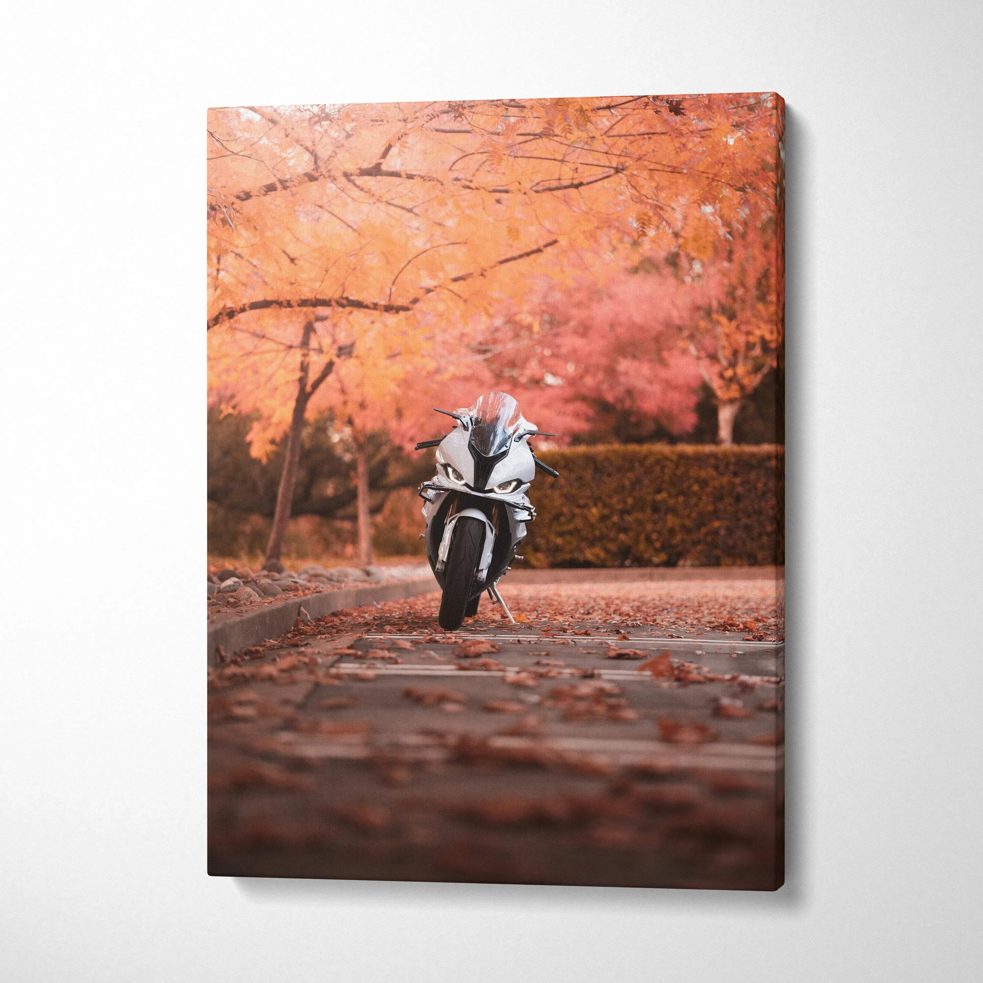 Vertical canvas art of a BMW S1000RR motorcycle on a leaf-covered path with autumn trees in warm tones.