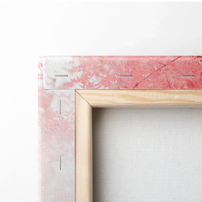 Close-up of wooden frame and wrapped edge on vertical canvas wall art with textured fabric and pink abstract design.