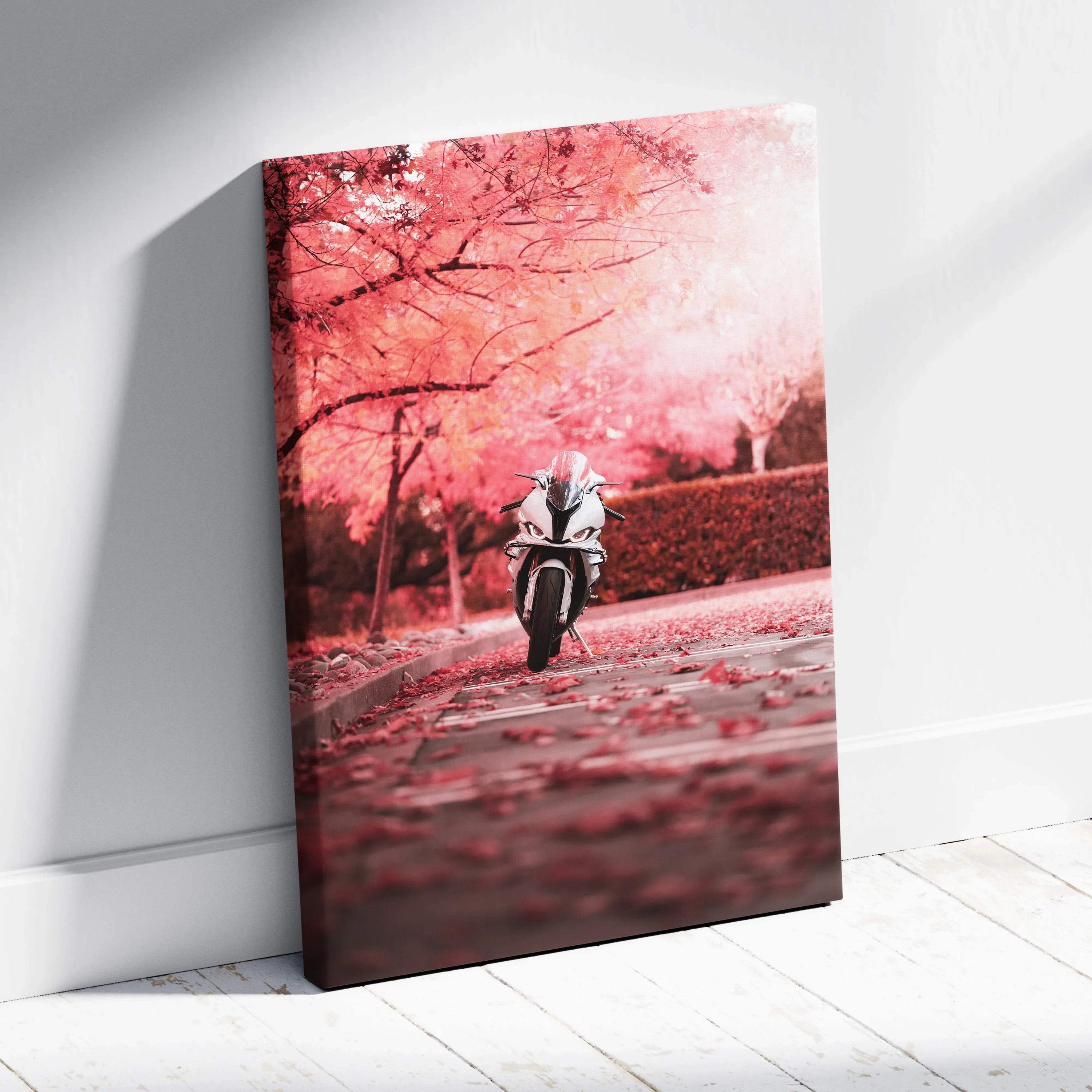 Vertical canvas wall art featuring a BMW S1000RR motorcycle riding down a pink autumn tree-lined path.