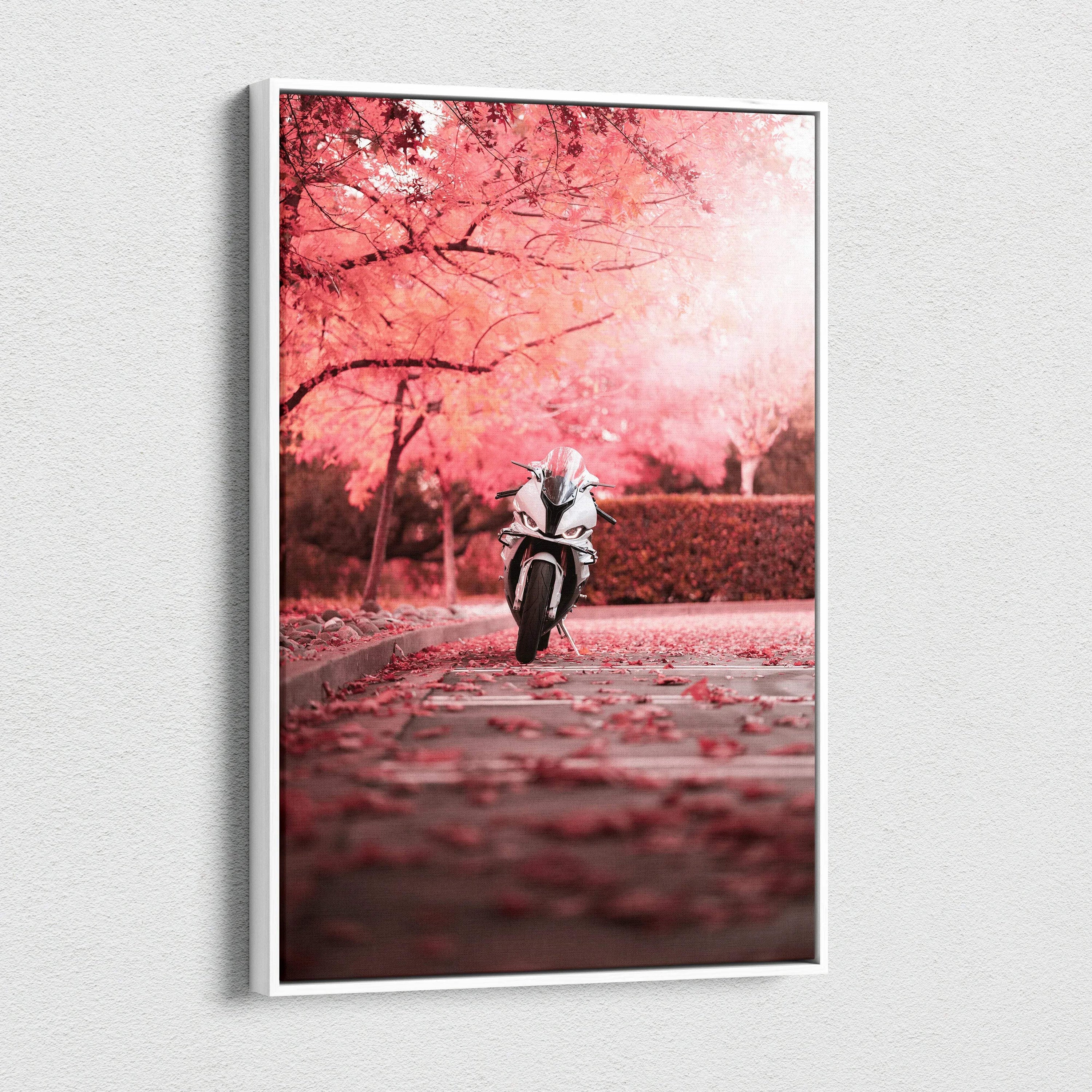 Vertical canvas wall art featuring a BMW S1000RR motorcycle under pink cherry blossom trees.