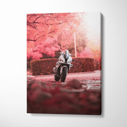 Vertical canvas art of a BMW S1000RR motorcycle speeding on a road with vibrant pink autumn foliage background wall art.