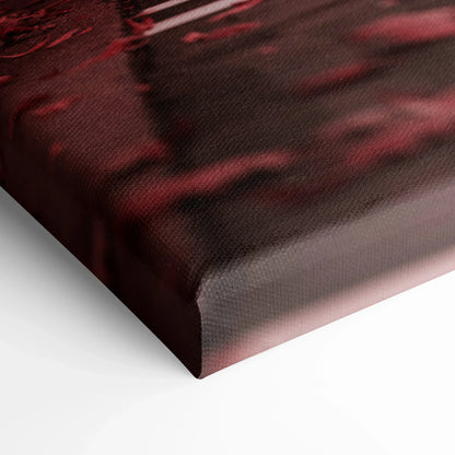 Close-up of black and red high-resolution canvas art corner with textured surface and museum-quality finish.