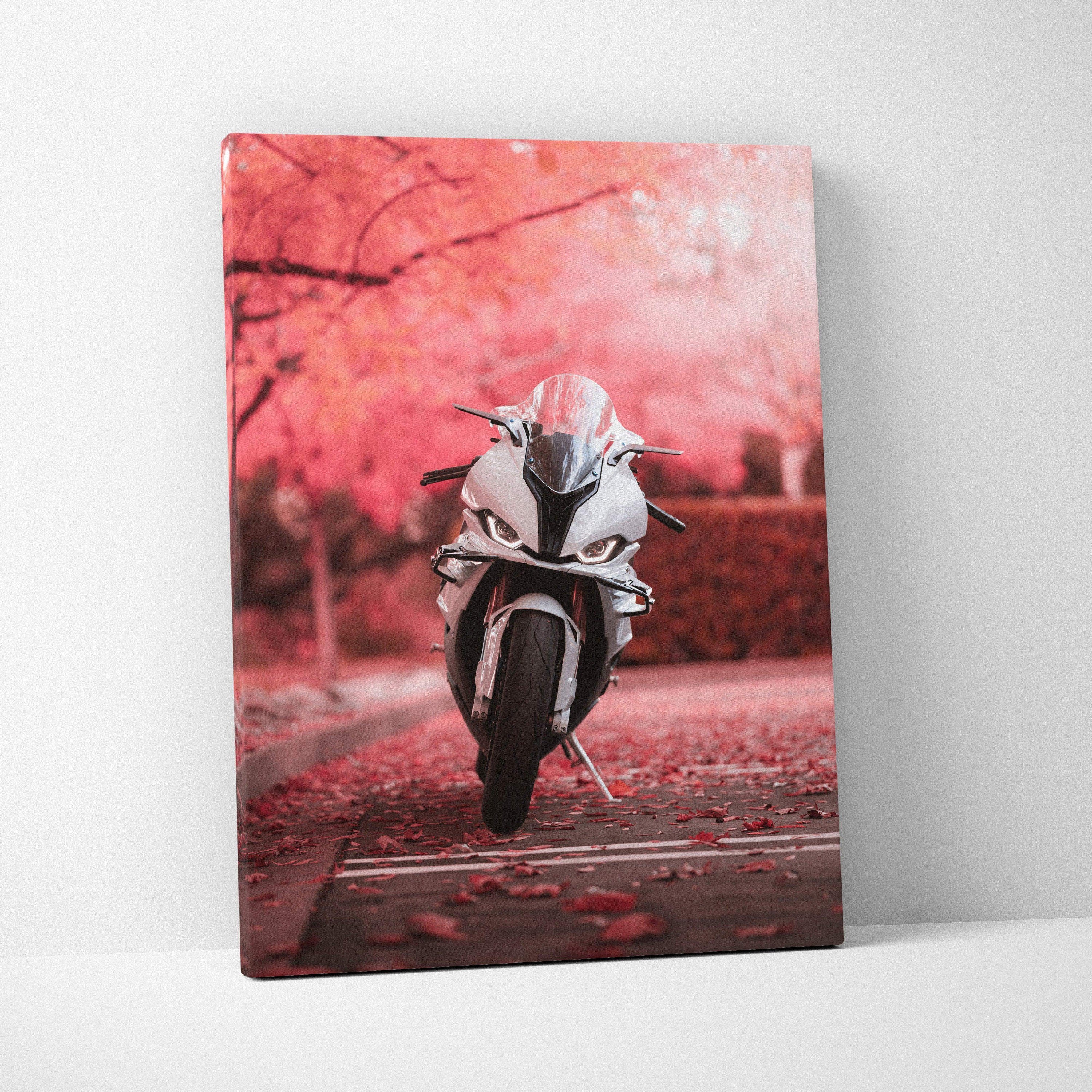 Vertical canvas wall art featuring a BMW S1000RR motorcycle with pink cherry blossom background.