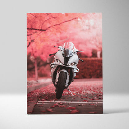 Vertical canvas art of a white BMW S1000RR motorcycle on a path with pink autumn trees wall art.