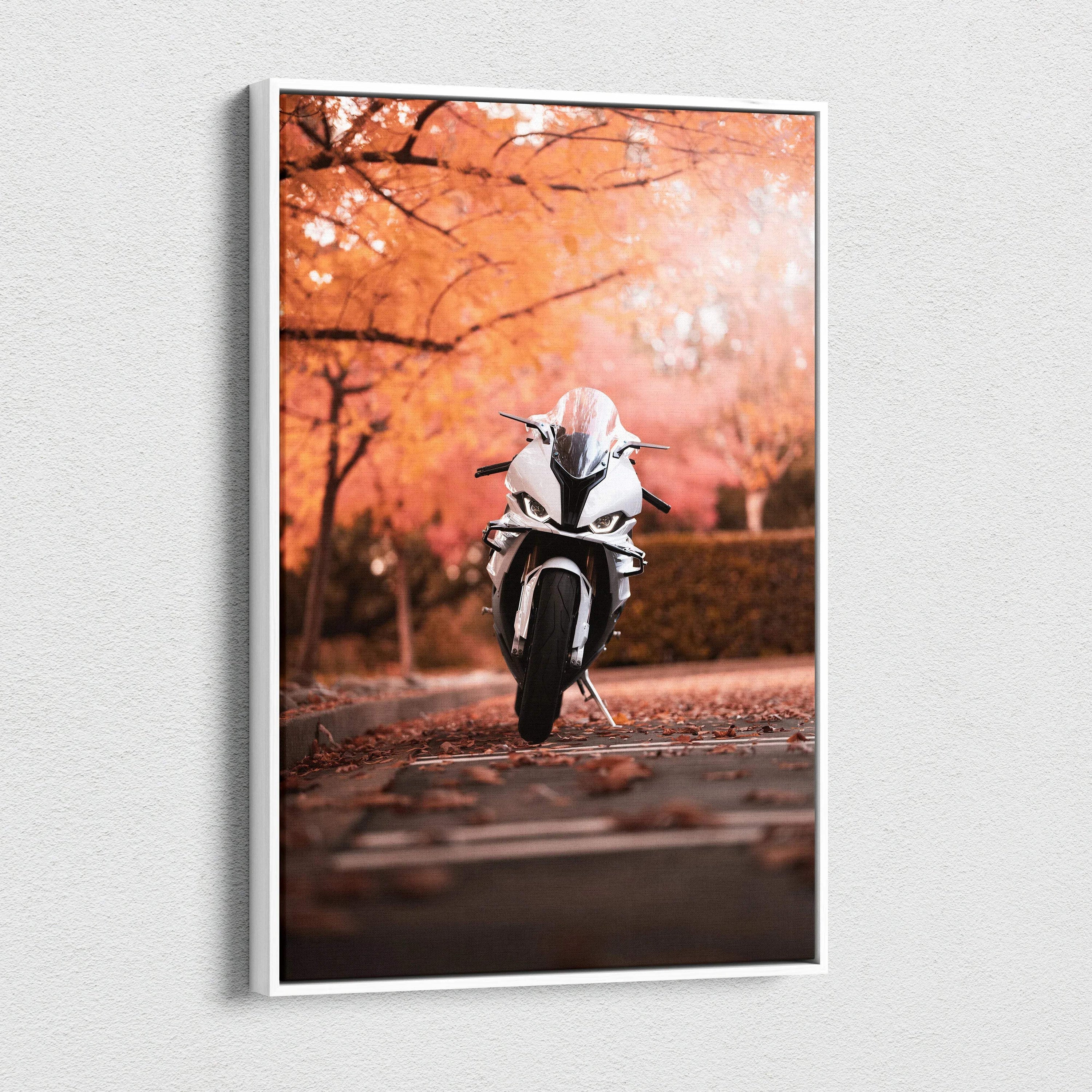 Vertical canvas wall art featuring a white BMW S1000RR motorcycle against autumn trees.