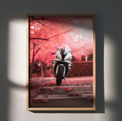 BMW S1000RR motorcycle poster with pink cherry blossom background wall art in wooden frame.