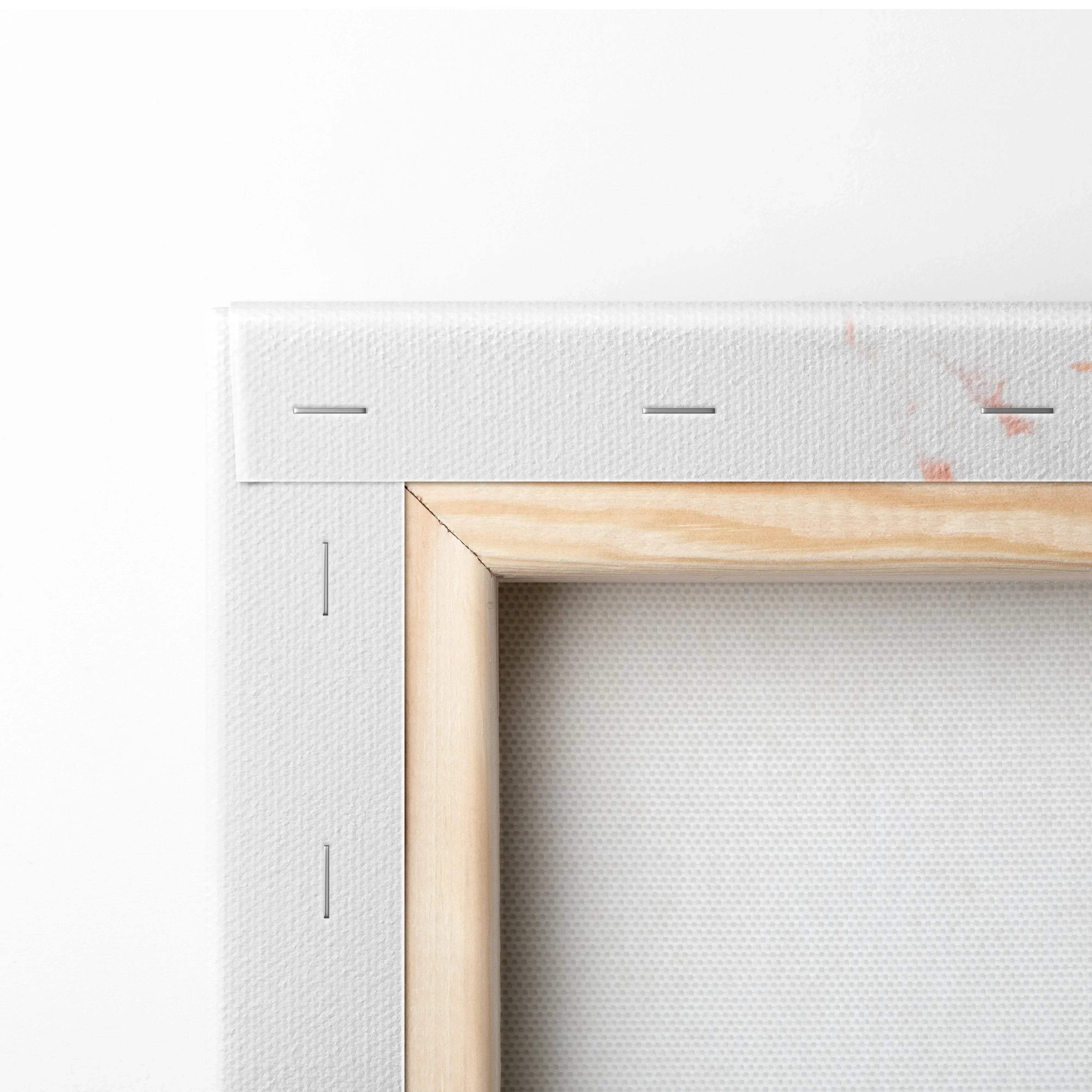 Close-up of white gallery-wrapped canvas with natural wood stretcher bars and metal staples, canvas art wall decor.