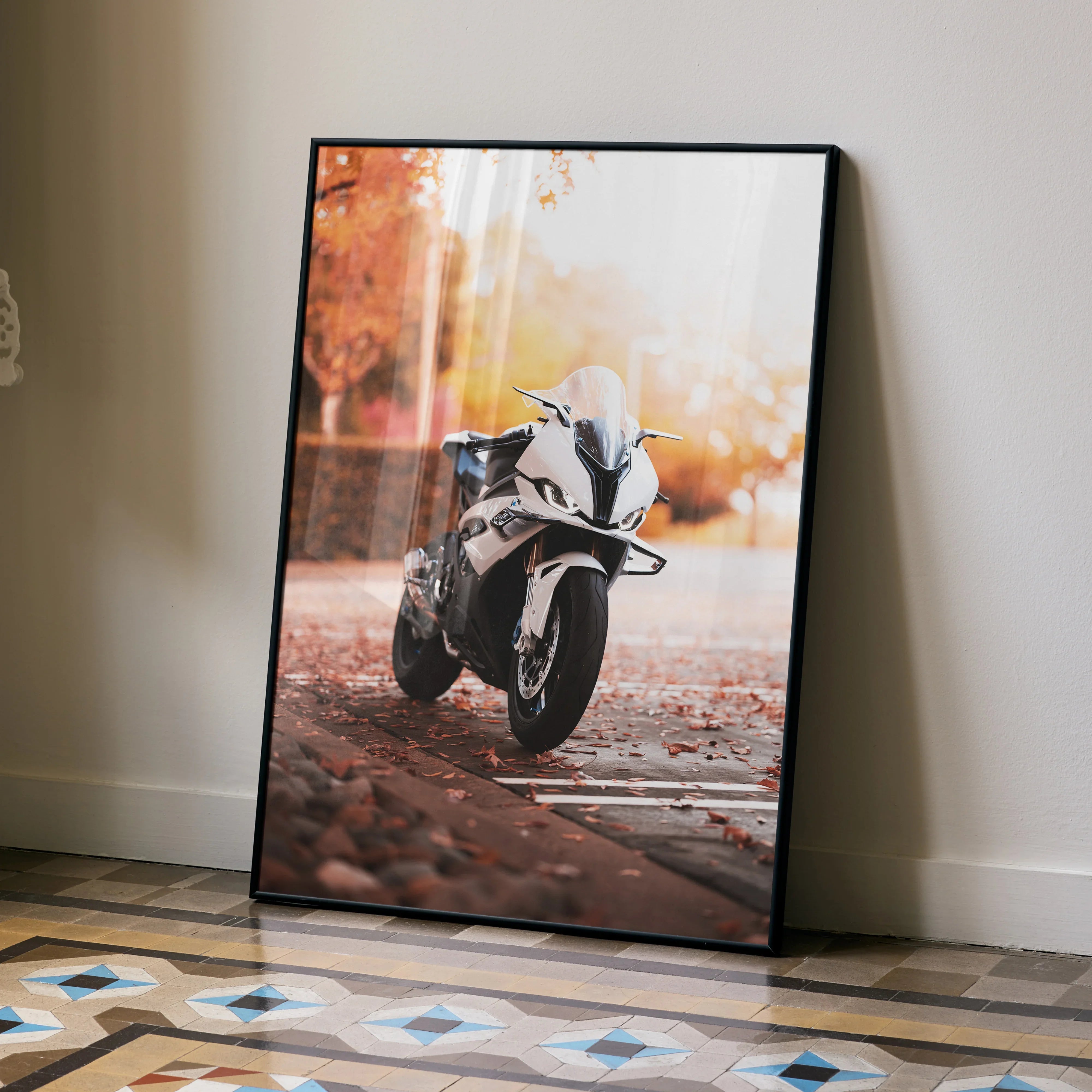 BMW S1000RR motorcycle poster wall art with autumn leaves background in a black frame.