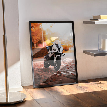 BMW S1000RR motorcycle poster with autumn background, sleek black frame wall art.