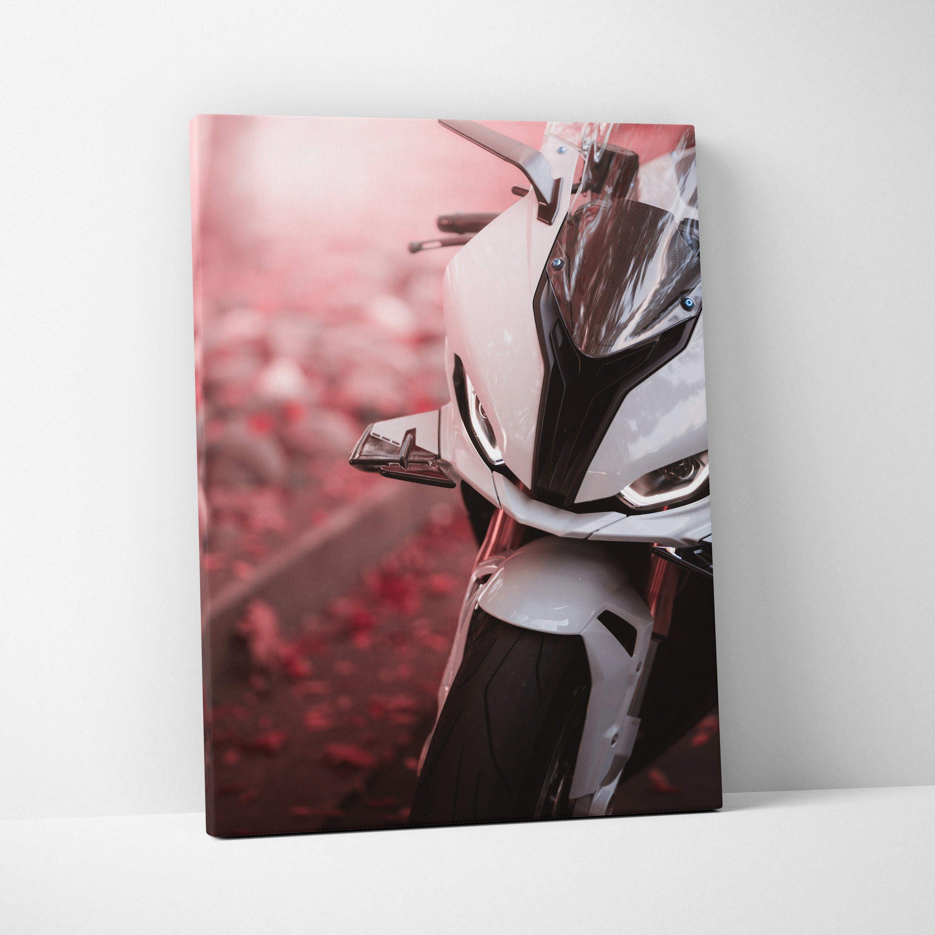 BMW S1000RR motorcycle close-up canvas art with white bike and red autumn leaves background.