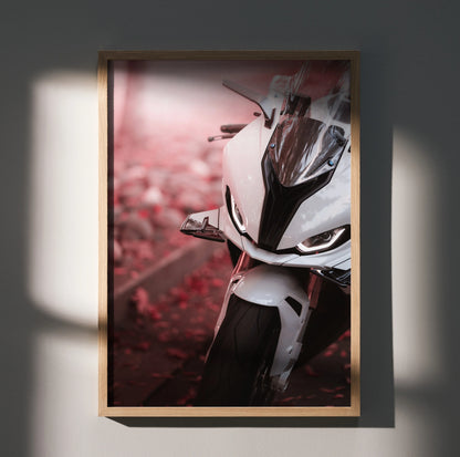 BMW S1000RR motorcycle close-up poster wall art with white bike and blurred pink background.