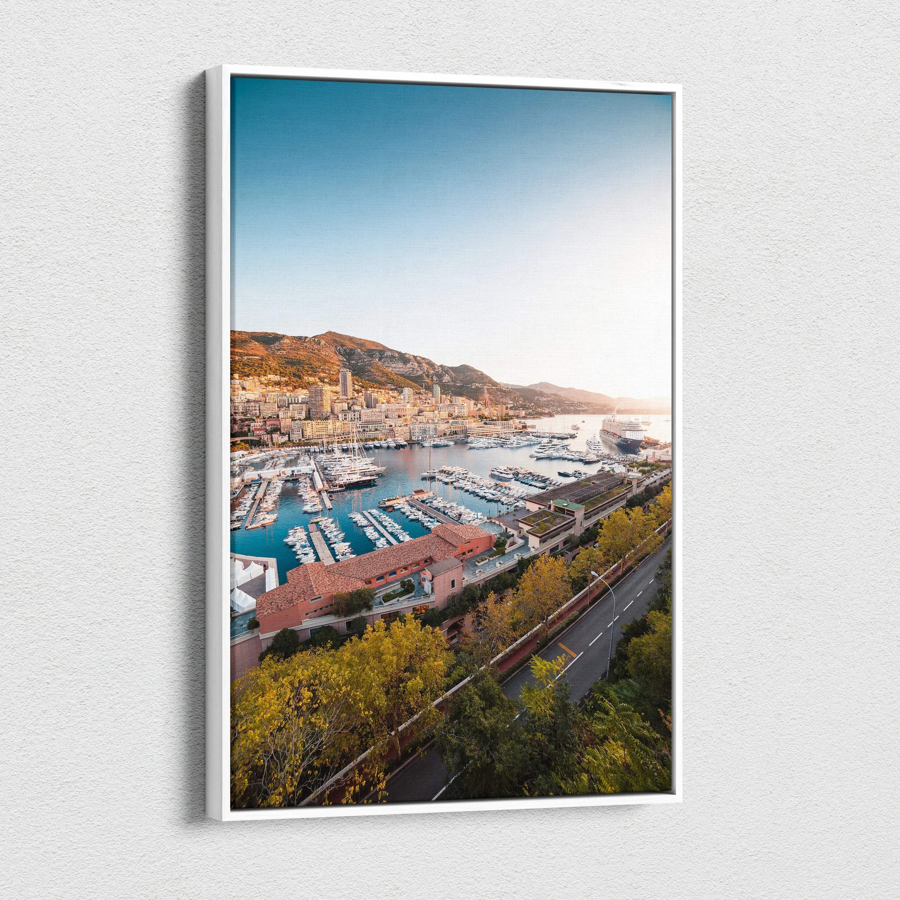 Canvas wall art featuring a vibrant harbor scene with boats, modern buildings, and hillside landscape under a clear blue sky.