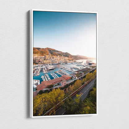 Canvas wall art featuring a vibrant harbor scene with boats, modern buildings, and hillside landscape under a clear blue sky.