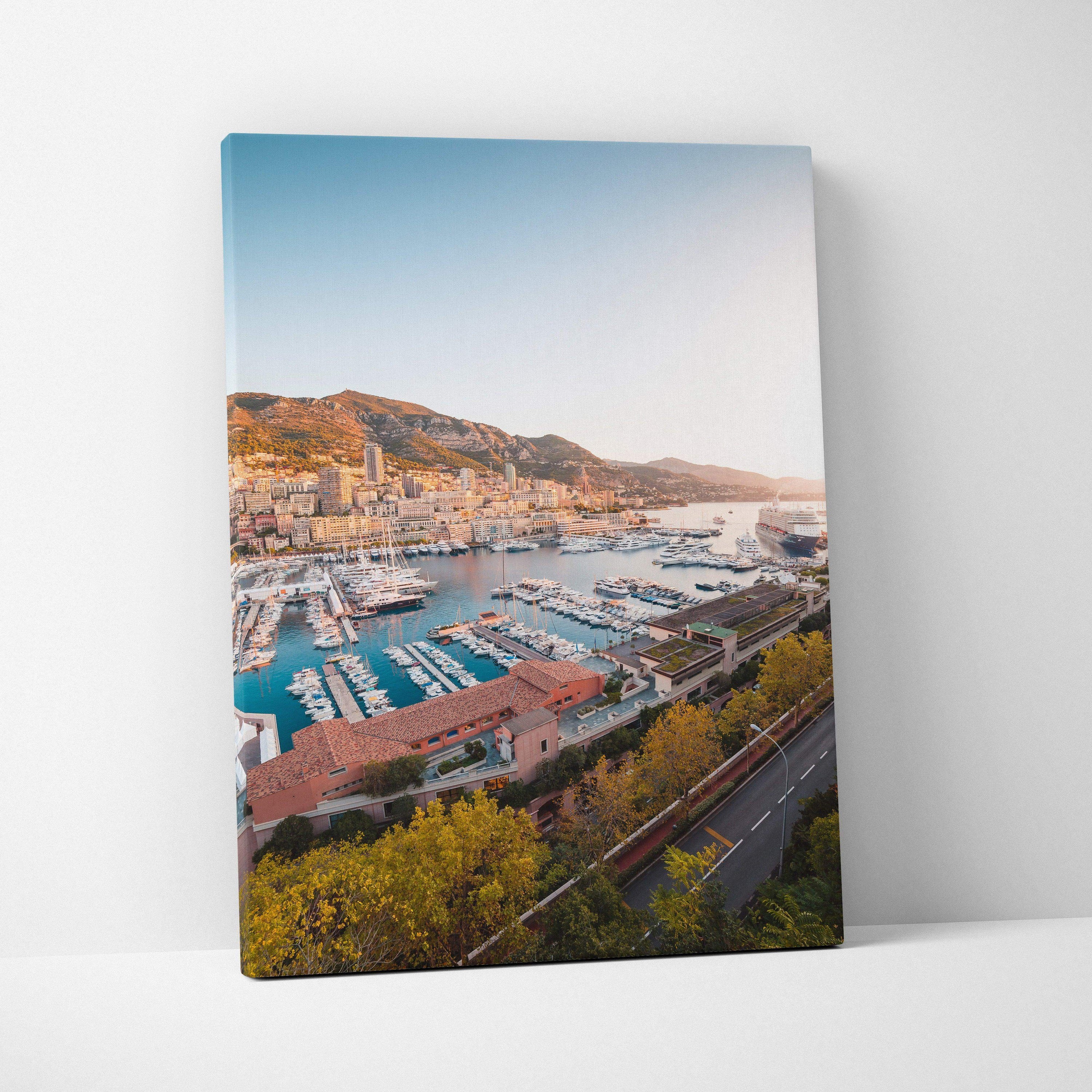 Canvas wall art featuring a vibrant coastal cityscape with boats docked in a marina under a clear blue sky.