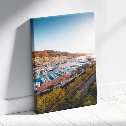 Canvas wall art featuring a vibrant harbor scene with boats, buildings, and hills under a clear blue sky.