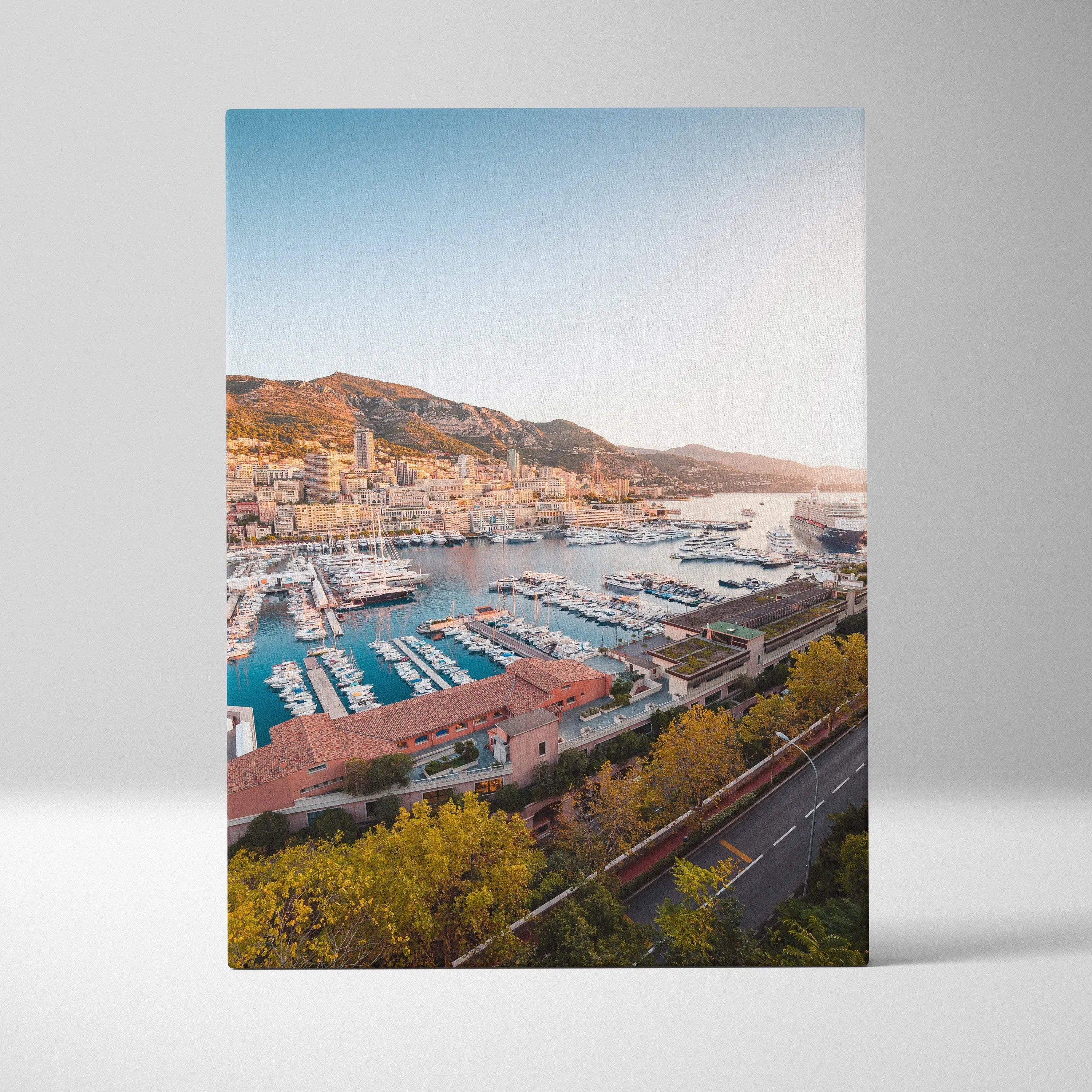Canvas wall art featuring a vibrant marina and hillside cityscape in warm sunlight.