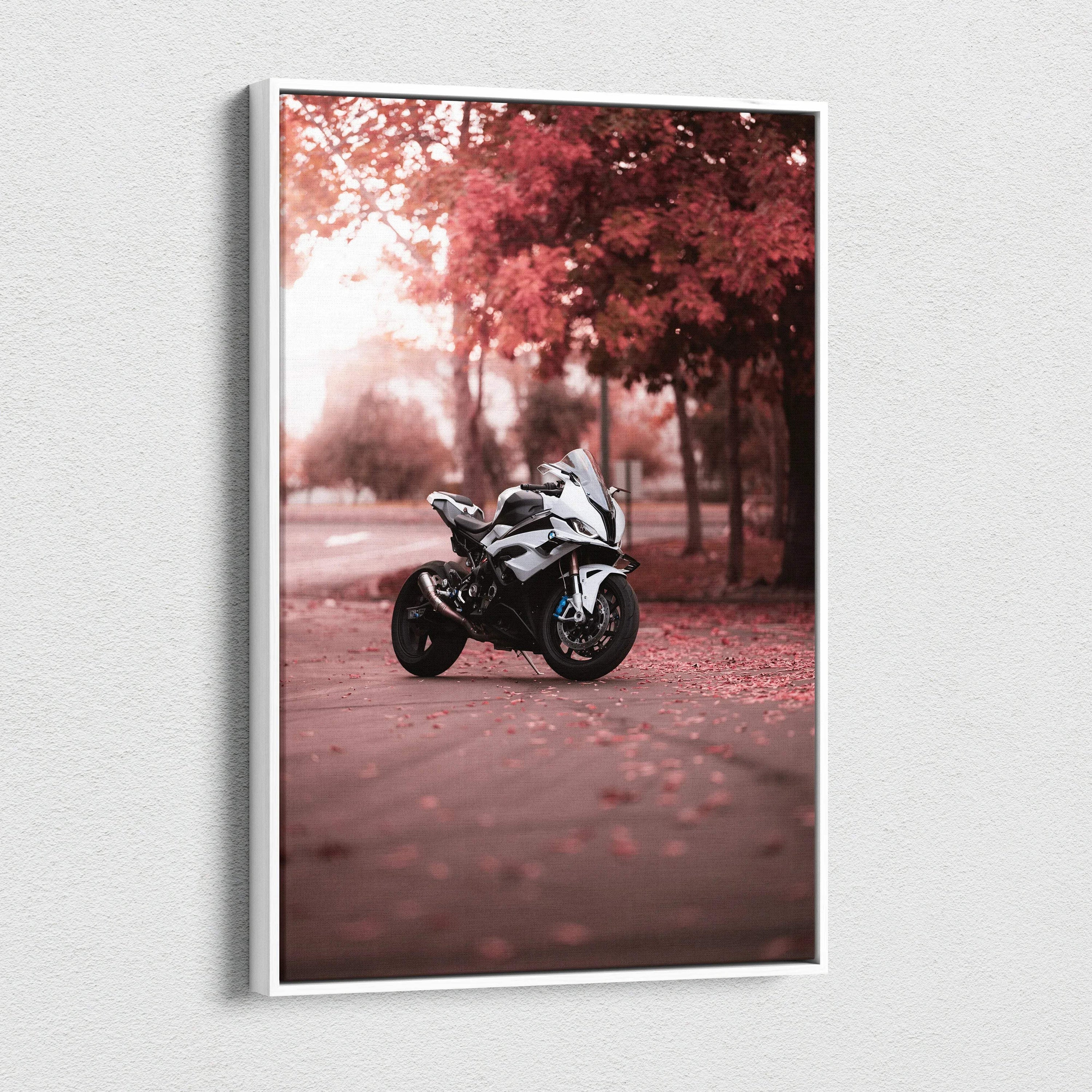 Vertical canvas art of a BMW S1000RR motorcycle parked on a leaf-covered path with autumn trees in the background.