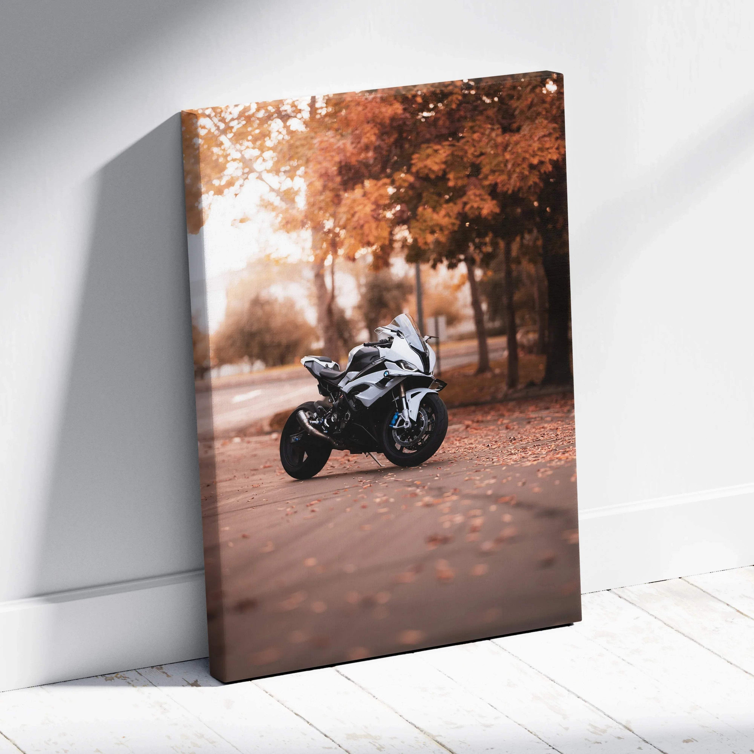 Vertical canvas wall art featuring a white BMW S1000RR motorcycle with autumn trees in the background.