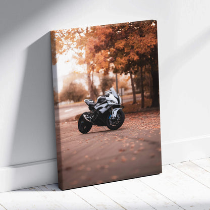 Vertical canvas wall art featuring a white BMW S1000RR motorcycle with autumn trees in the background.