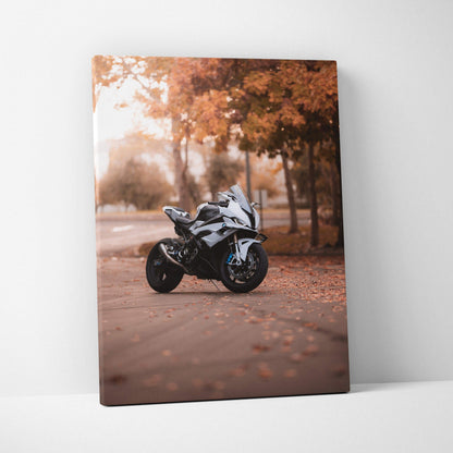 Vertical canvas art featuring a white BMW S1000RR motorcycle on an autumn road with orange leaves.