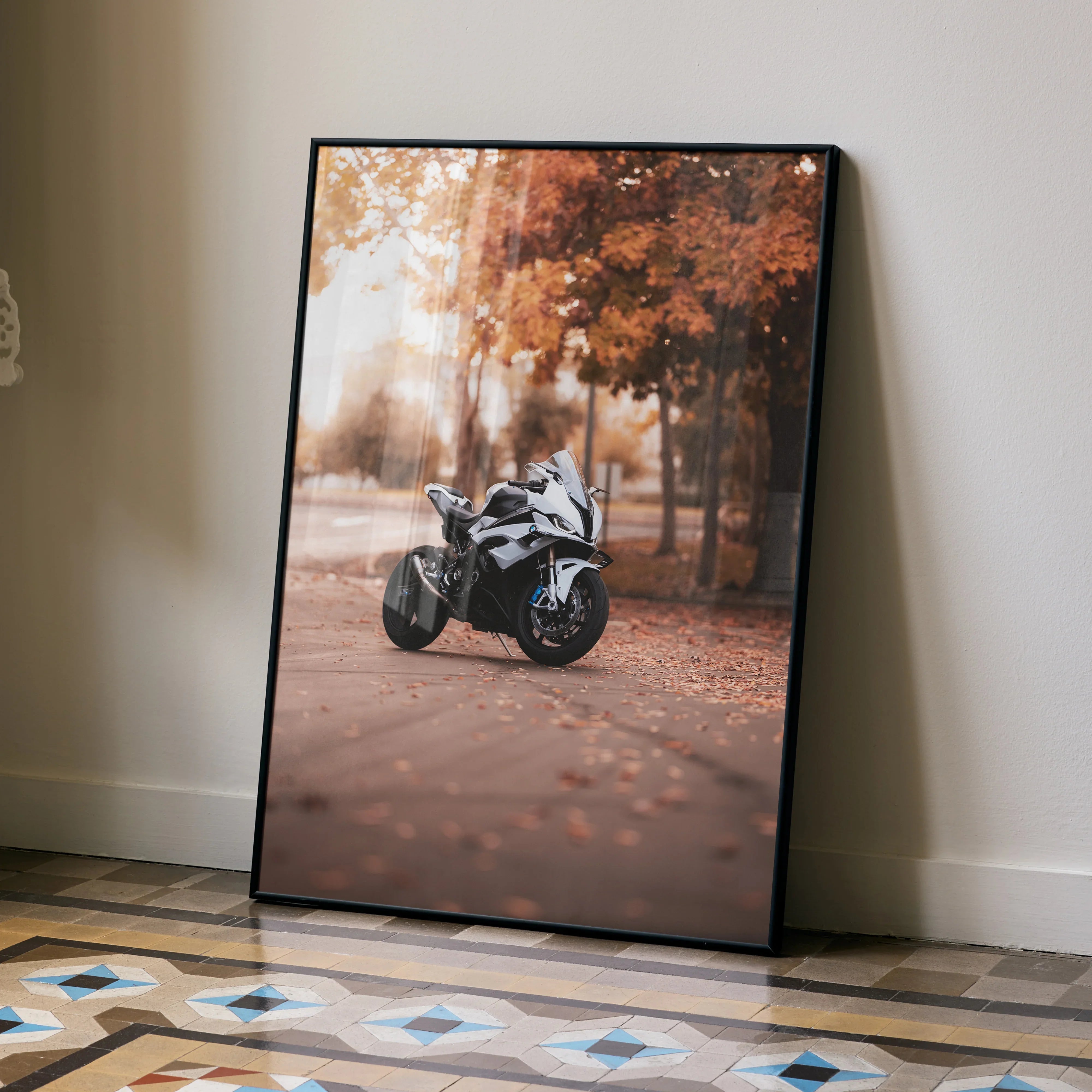 BMW S1000RR motorcycle poster with autumn forest background wall art in black frame.
