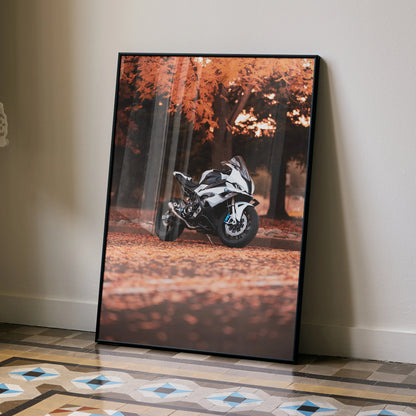 BMW S1000RR motorcycle poster with autumn forest background wall art in black frame.