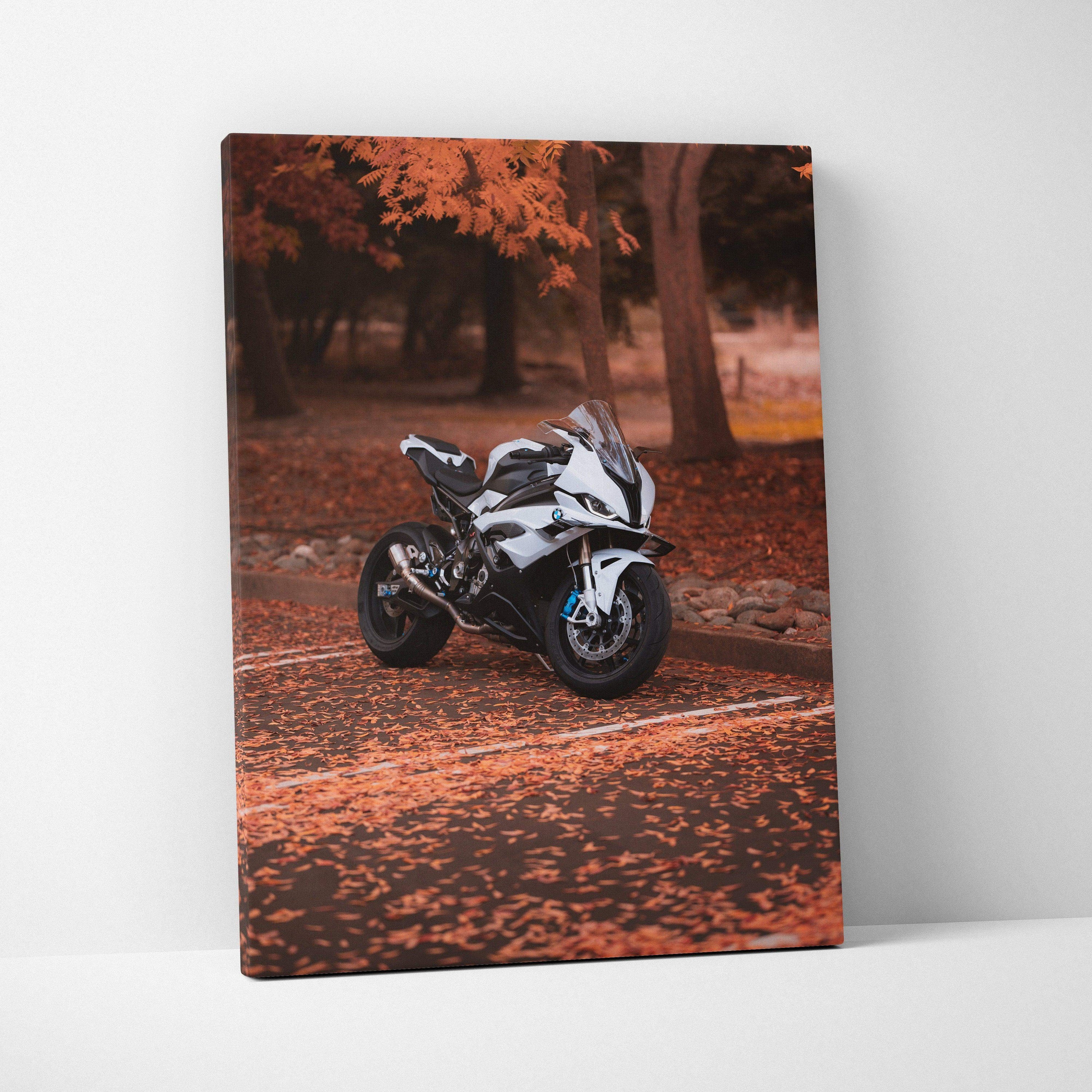 Vertical canvas art of a BMW S1000RR motorcycle in an autumn forest with orange leaves.