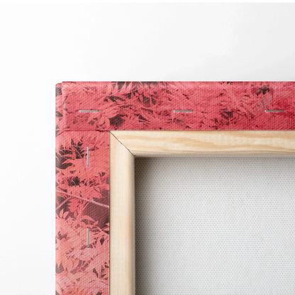 Close-up of corner on red textured canvas art with wooden frame for wall art display.