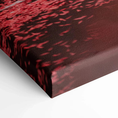 Close-up of red and black textured canvas wall art with detailed fabric weave on vertical canvas print edge.