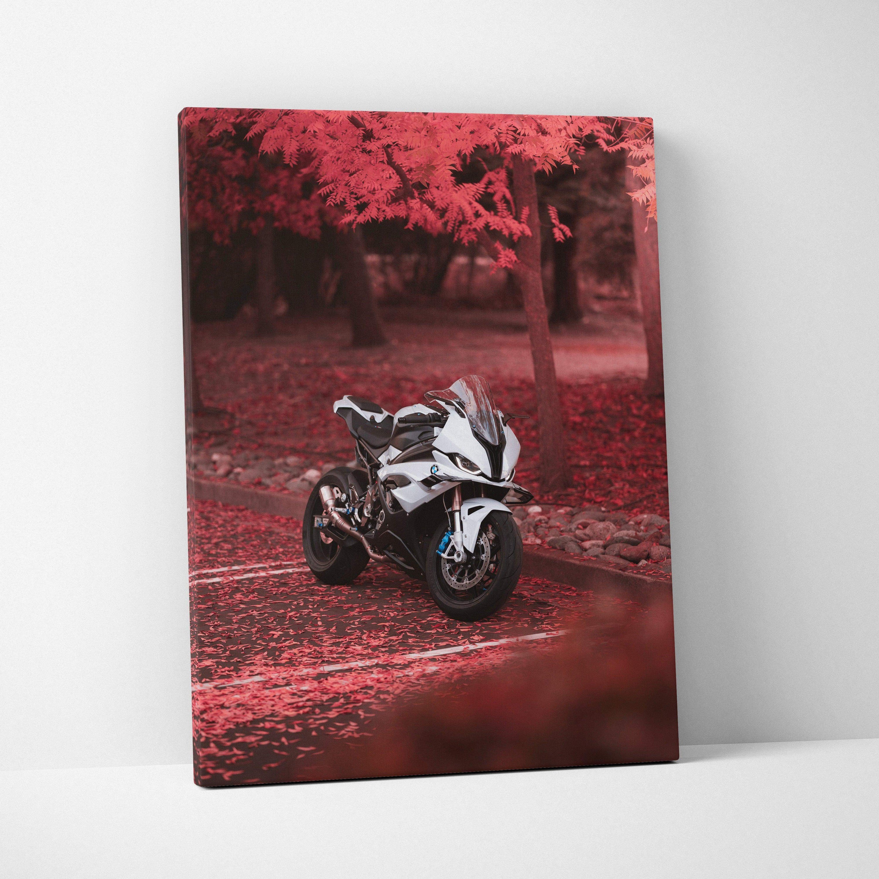 Vertical canvas wall art featuring a BMW S1000RR motorcycle against vibrant red autumn foliage background.