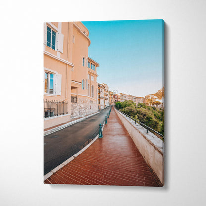 Vertical canvas wall art featuring detailed architecture along a pastel street under a clear blue sky.