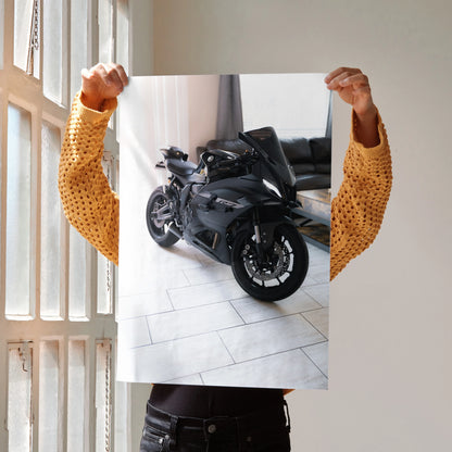Yamaha R7 black motorcycle poster held indoors, sleek design, wall art for motorcycle fans.