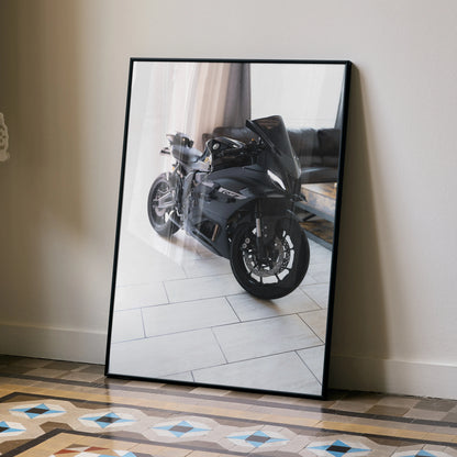 Yamaha R7 motorcycle poster in sleek black frame leaning on floor, modern wall art with reflective glass.