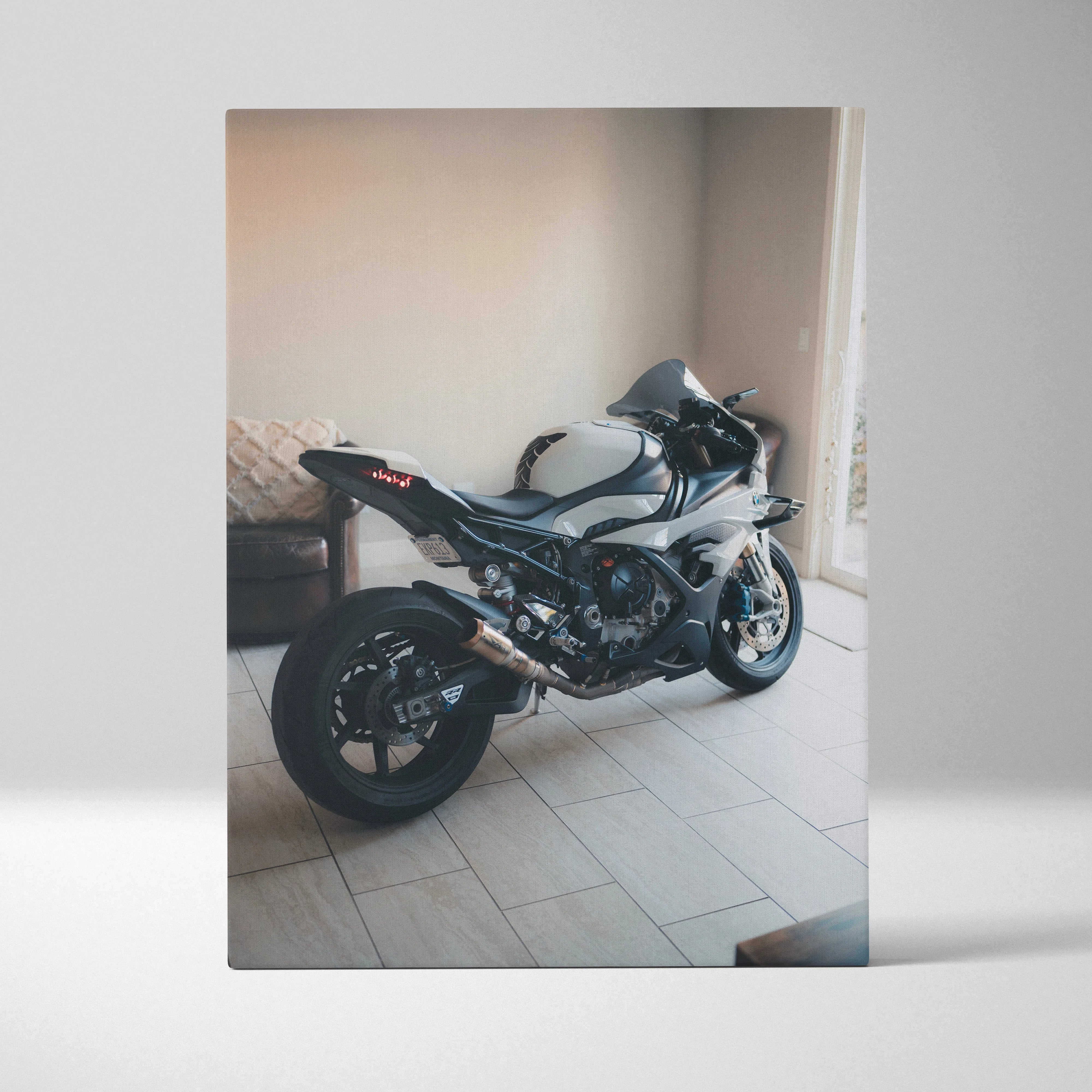 BMW S1000RR motorcycle art on vertical canvas wall art with sleek black and silver design.